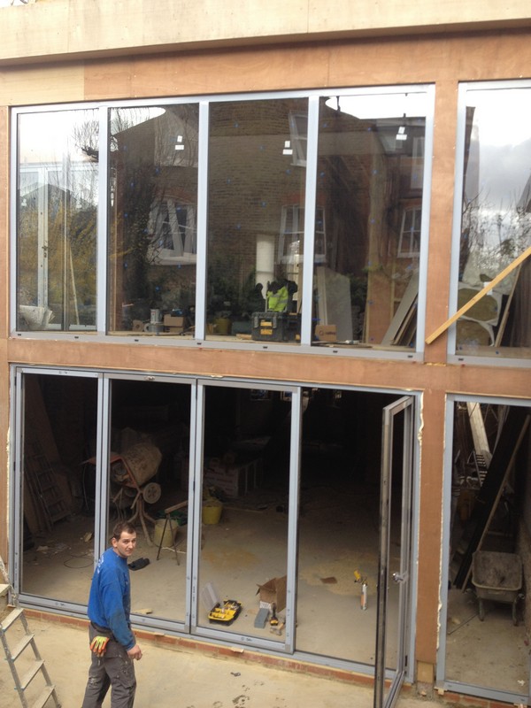 Aluminium bi-fold doors with two-storey glazing in Colindale