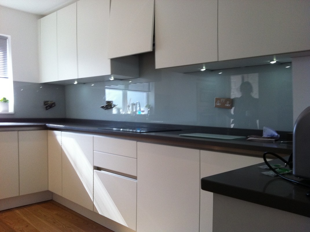 Grey glass kitchen splashback with LED lighting in Colindale