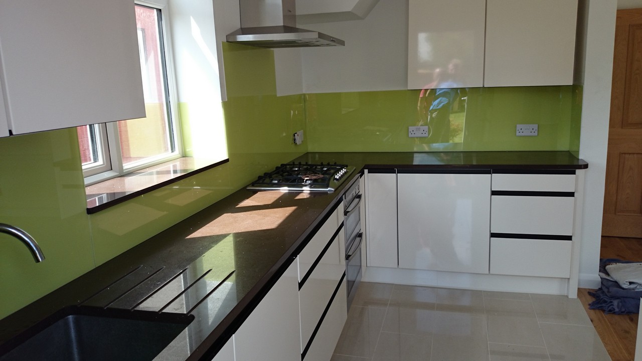 Lime green glass kitchen splashback installed by Colindale glaziers