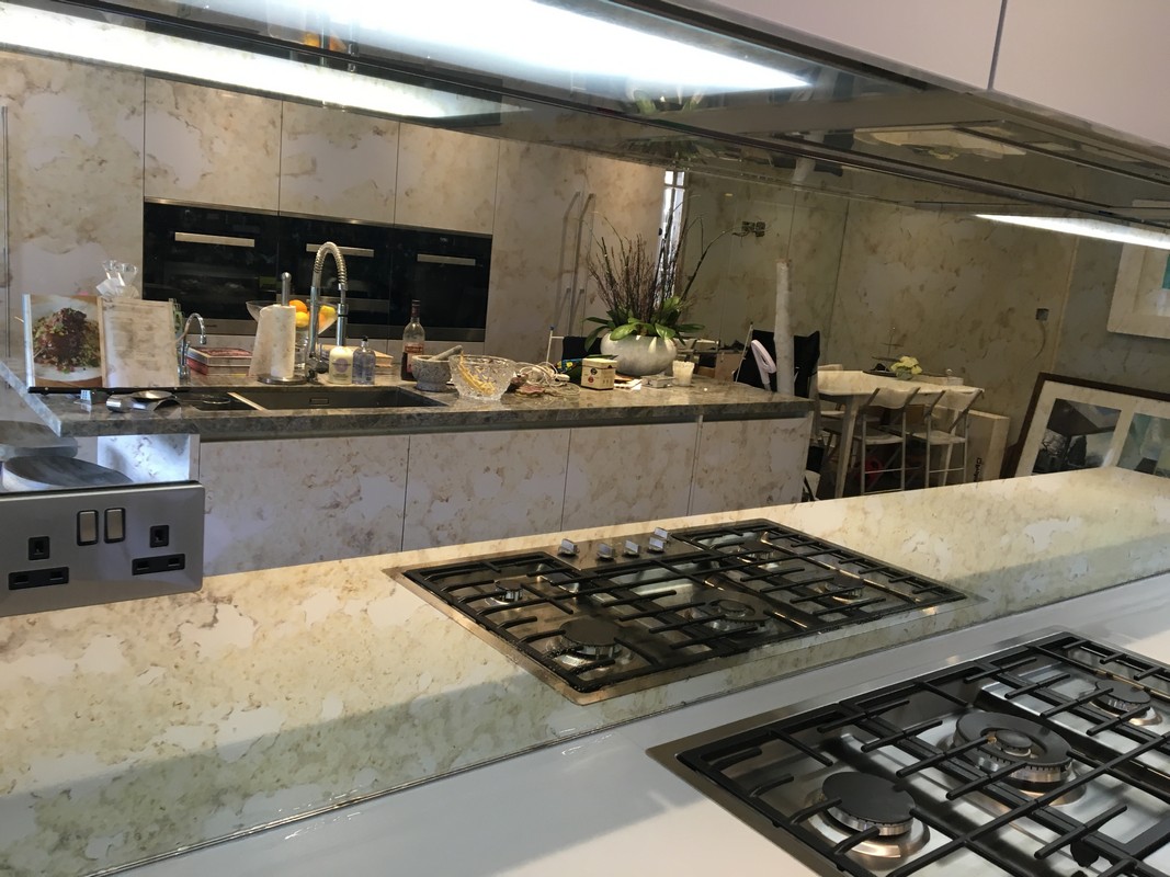 Mirror glass splashback in Colindale luxury kitchen