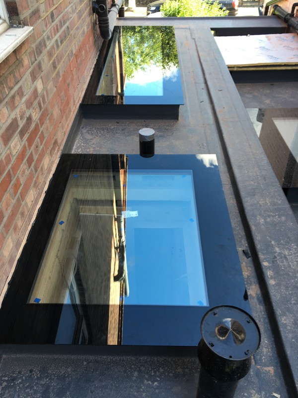 Multiple flat roof skylights on extension in Colindale