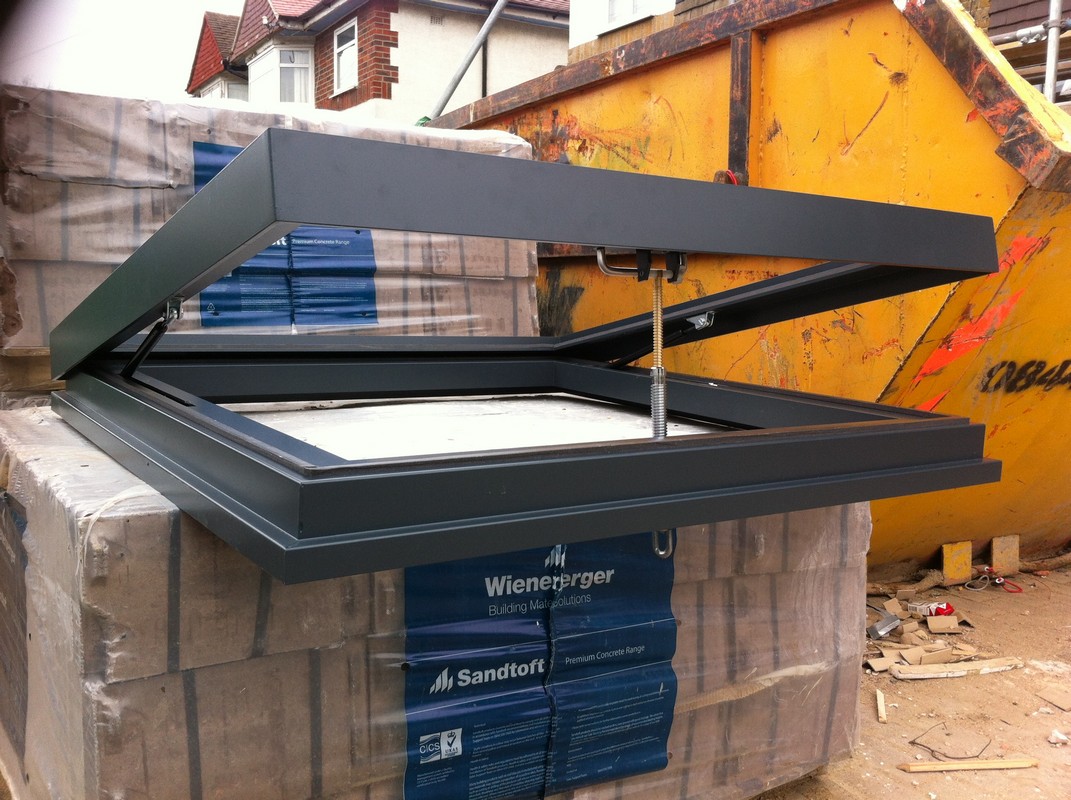 Opening flat roof skylight in anthracite grey installed in Colindale