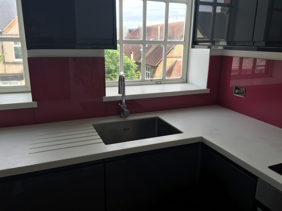 Deep plum coloured glass splashback in modern Colindale kitchen